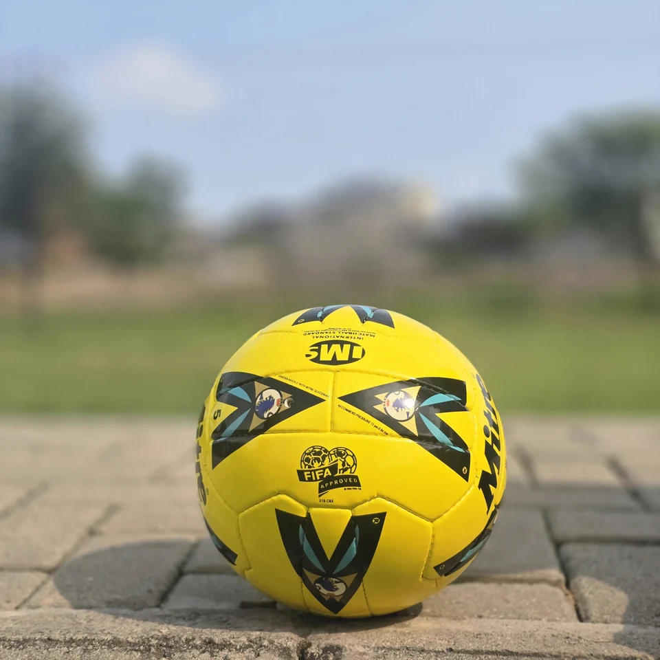 Yellow Black Graphic Hand-Stitched Football alternate front angle - bright yellow handmade football with black angular graphic panels