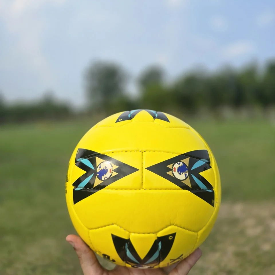 Yellow Premier-Style Printed Hand-Stitched Football alternate front angle - yellow handmade football with black graphic panels and visible printed match-ball style text